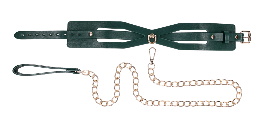 Emerald green cutout collar with gold hardware and matching chain leash.