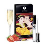 Shunga Sensual Oral Pleasure Lipgloss in Strawberry Wine with a champagne flute and strawberries.