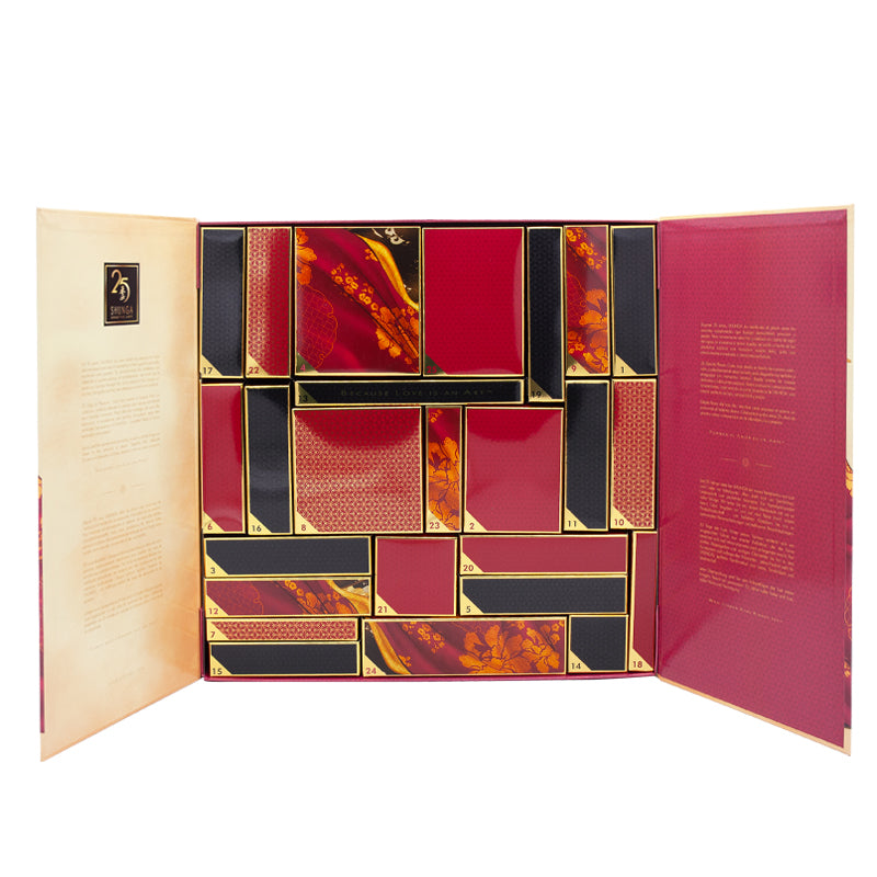A red and gold open box with 25 numbered compartments containing Shunga products.