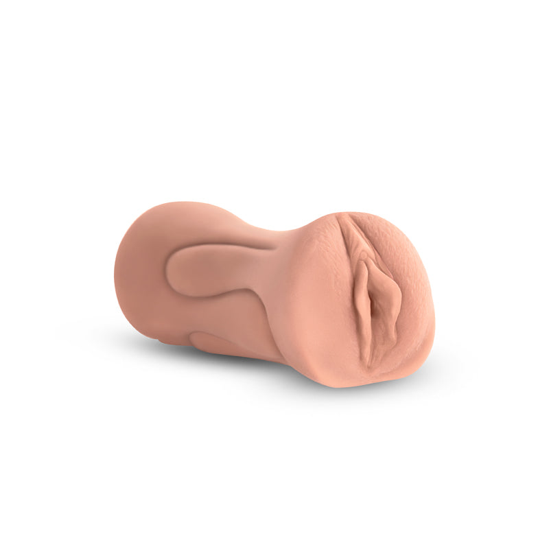 Tan realistic TPE stroker with textured shaft.