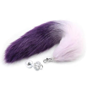 Purple and pink ombre faux fox tail with a silver anal plug.