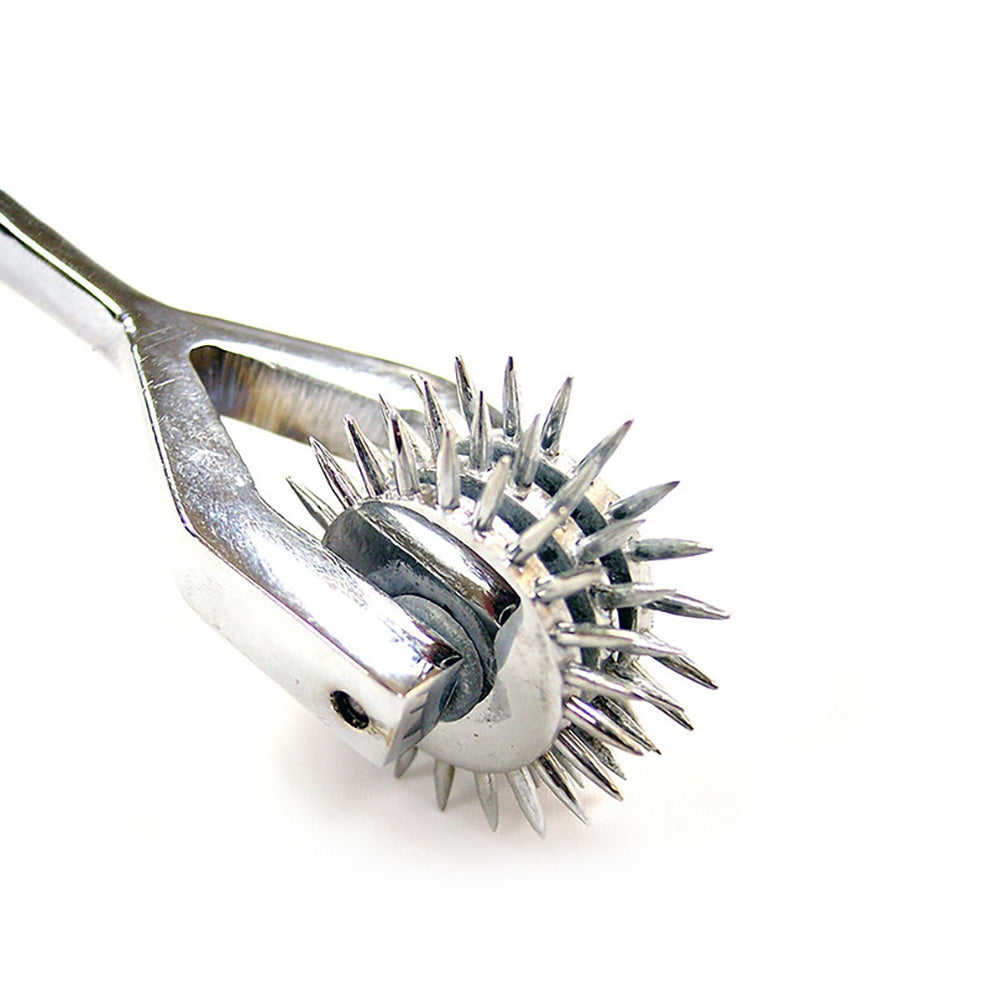 Triple head stainless steel sensory pinwheel with sharp spikes.