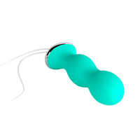 Green pelvic floor trainer with a white cord.