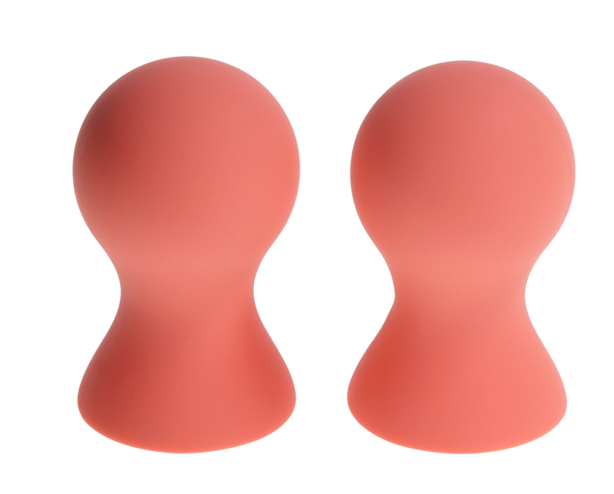Two pink silicone nipple suckers with a rounded top and hourglass shape.
