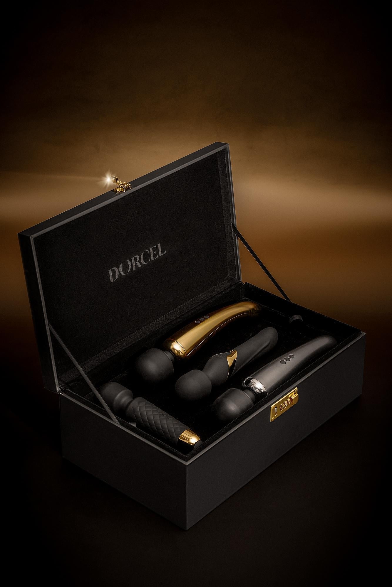 A black faux leather storage case with a combination lock, containing four vibrators.