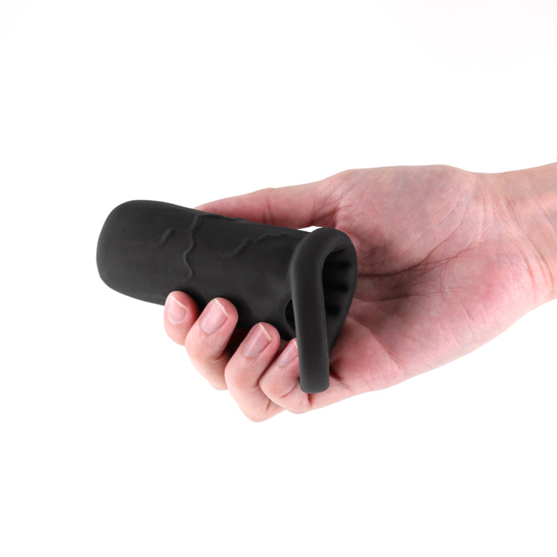 Black stretchy silicone sleeve held in a hand.
