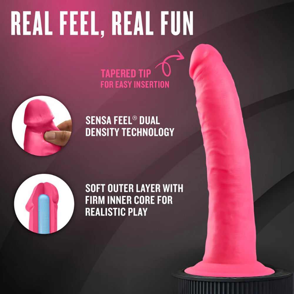 Neon pink dual density silicone dildo with tapered tip and suction cup base.