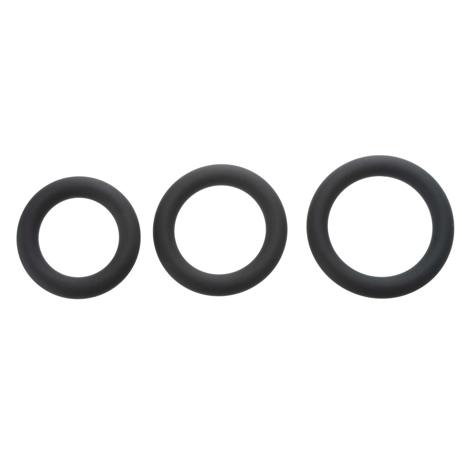 Three black silicone rings of varying sizes.