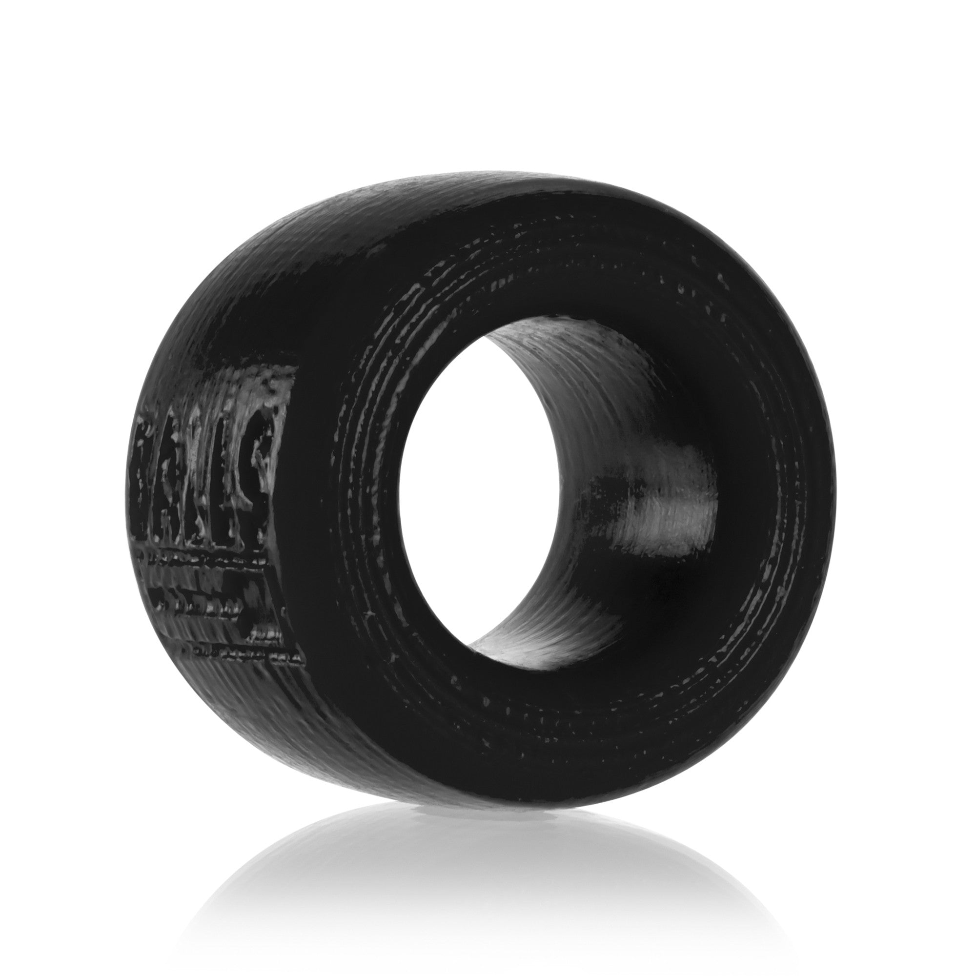 Black textured silicone ball stretcher ring with embossed logo.