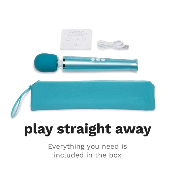 A teal wand massager with a charging cable, manual, and storage pouch.