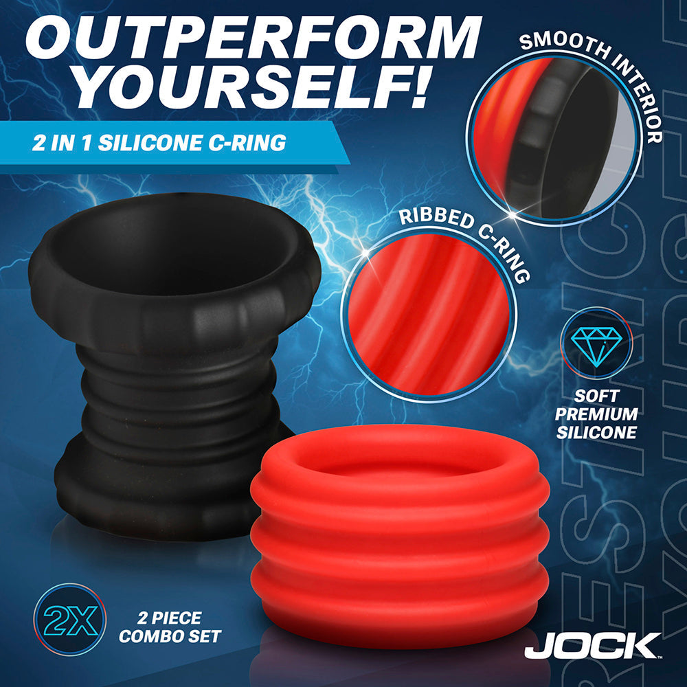 A 2-in-1 silicone cock ring and ball stretcher set in red and black.