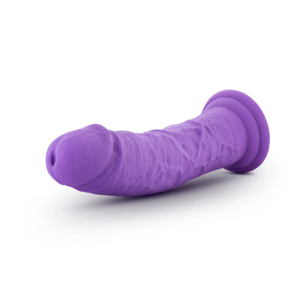 A purple textured dildo with a suction cup base.