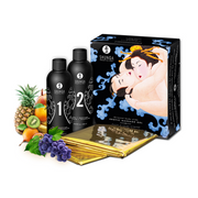 Shunga Oriental Body-to-Body Massage Gel set with fruits and a gold sheet.