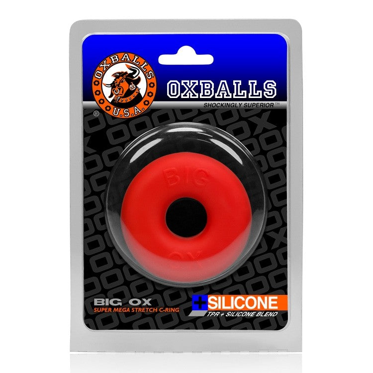 Red silicone Oxballs Big Ox cock ring and ball stretcher in packaging.