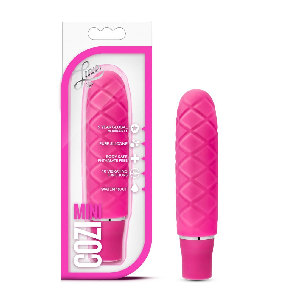 Fuchsia pink Cozi Mini waterproof silicone vibrator with textured surface.
