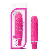Fuchsia pink Cozi Mini waterproof silicone vibrator with textured surface.