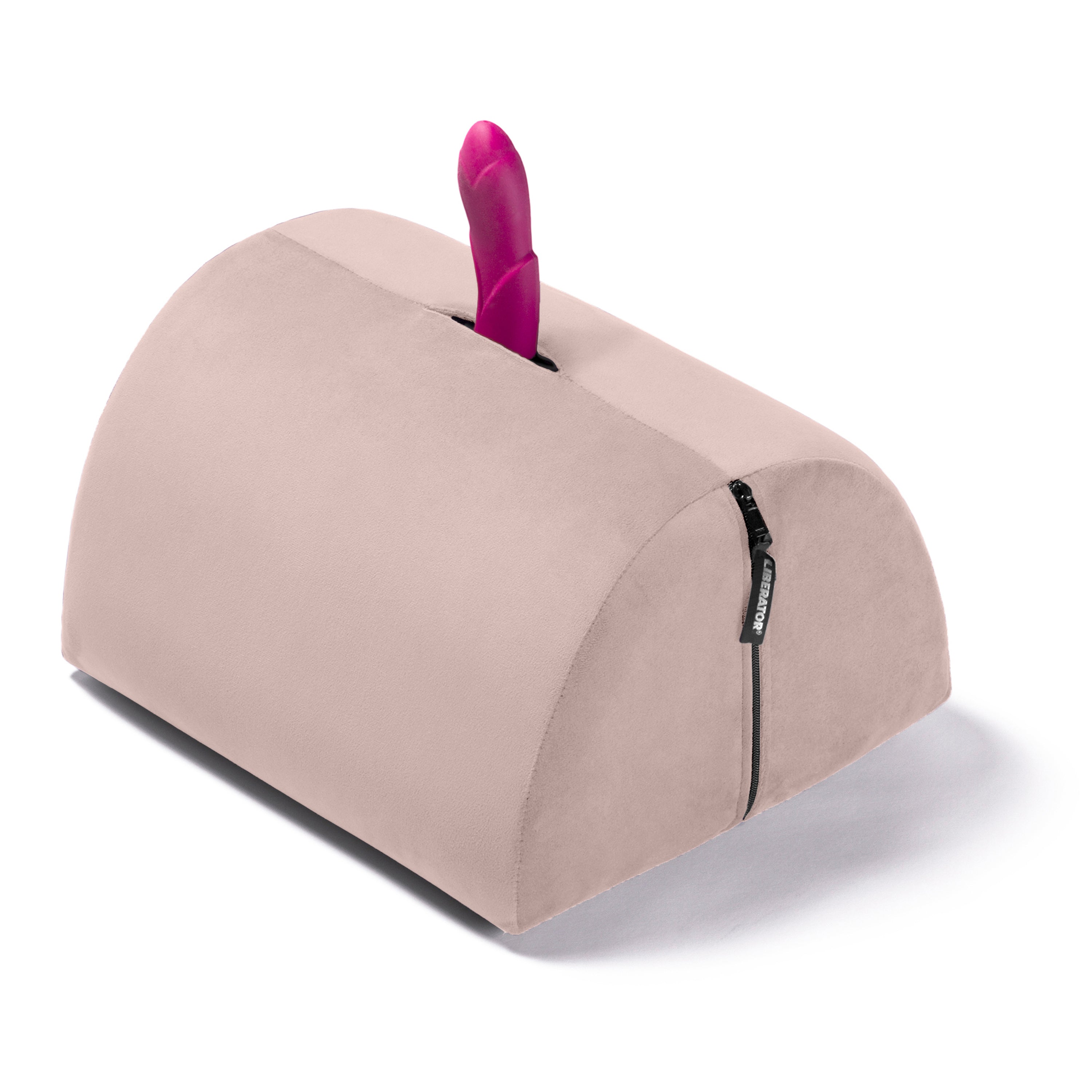 A pink sex toy is inserted into a beige crescent-shaped pillow with a zipper.