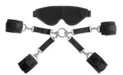 Black bondage restraint kit with blindfold and cuffs.