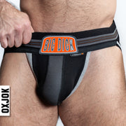 Black jockstrap with orange "BIG DICK" logo and grey pouch.