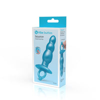 A blue beaded silicone anal plug with a retrieval ring on a white box.