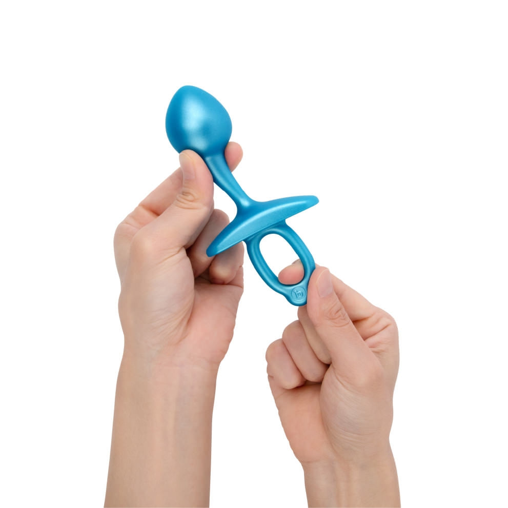 A blue silicone prostate plug with a bulbous tip and a retrieval ring.