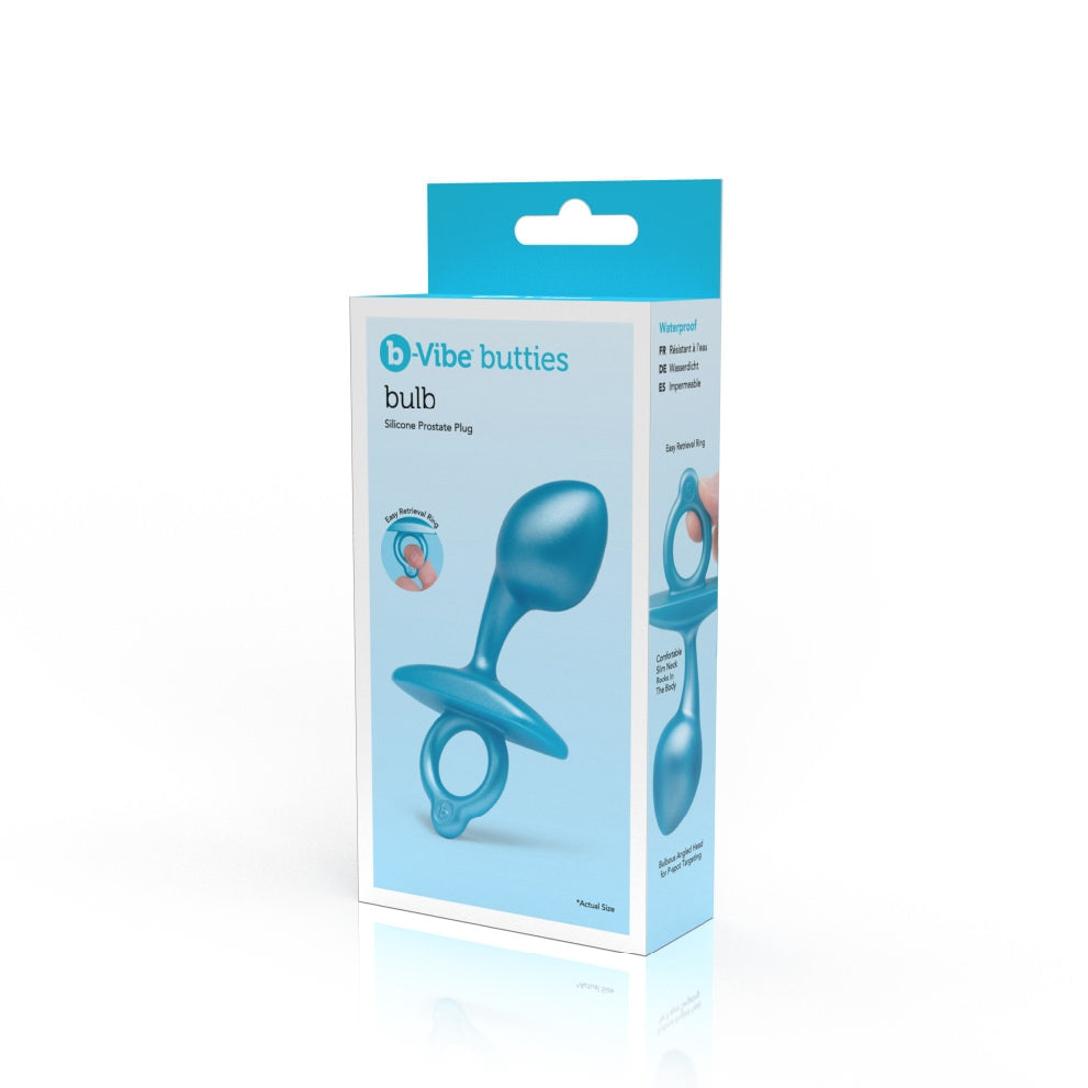 A blue silicone prostate plug with a bulbous head and retrieval ring on its packaging.