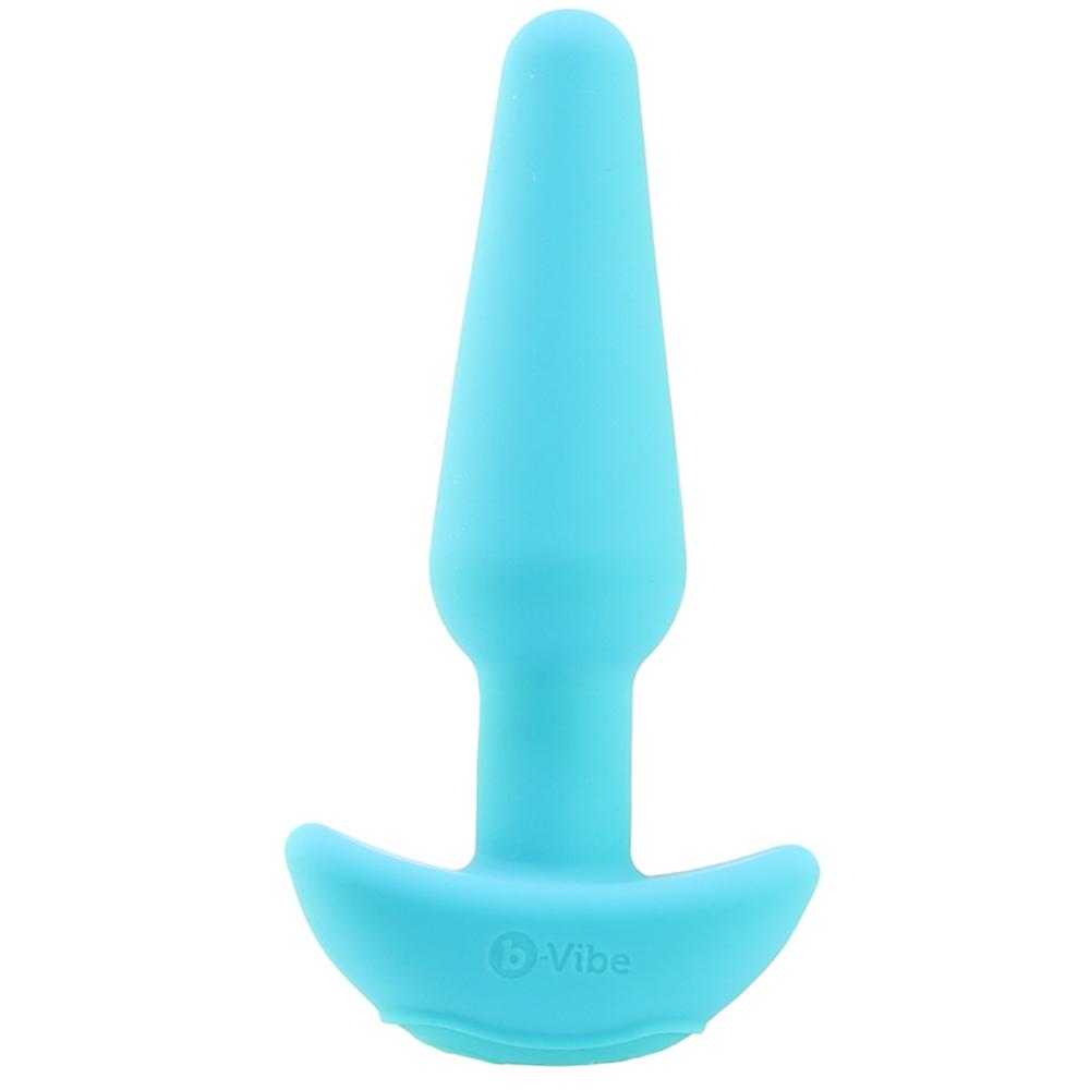 A teal silicone butt plug with a flared base and the b-Vibe logo.