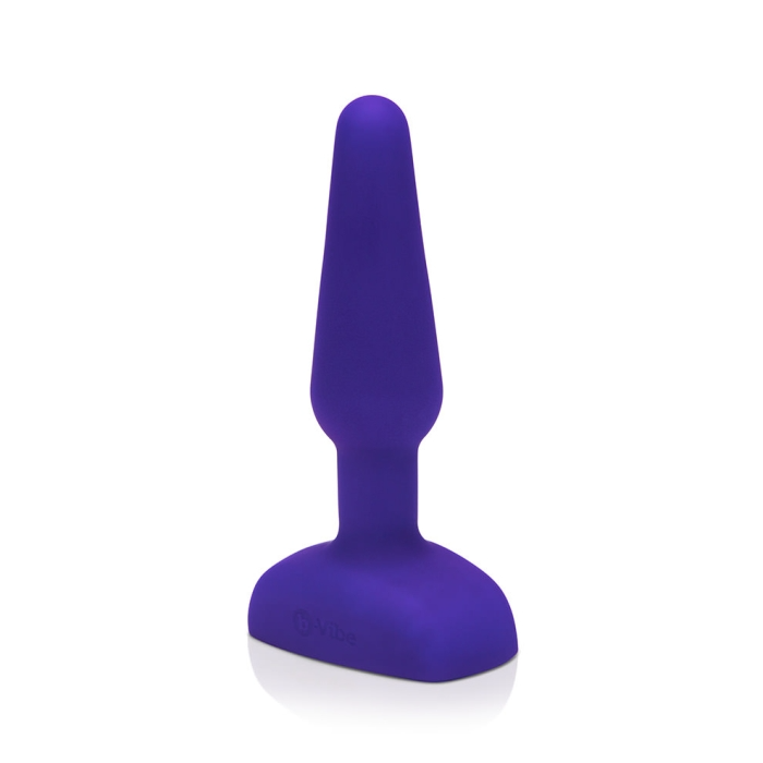 Purple silicone butt plug with a flared base and a tapered insertable end.