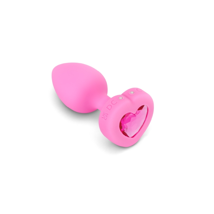 Pink silicone vibrating heart anal plug with a jewel accent.