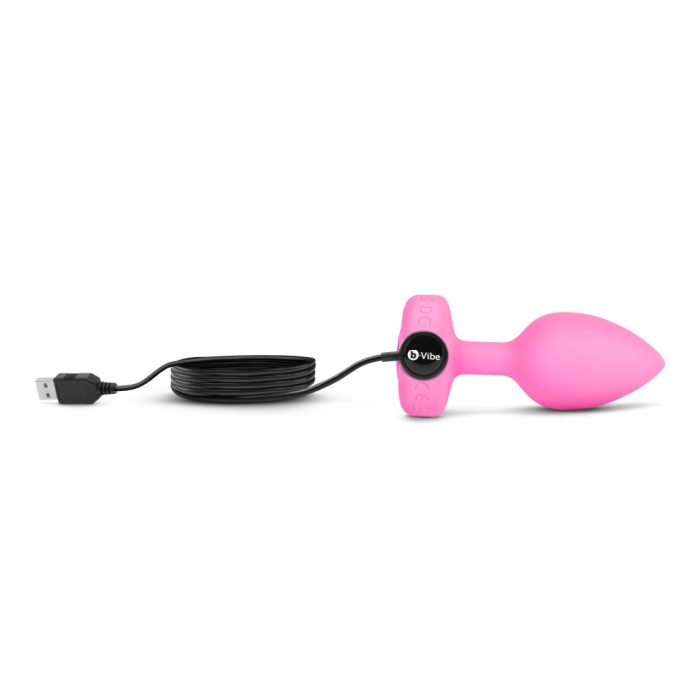 Pink silicone vibrating anal plug with USB charging cable.