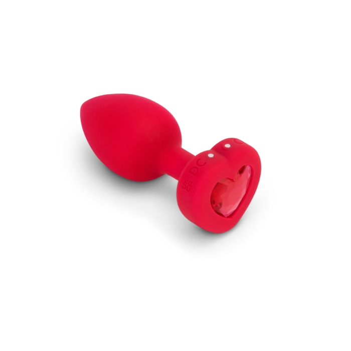 Red silicone anal plug with a heart-shaped base and jewel.