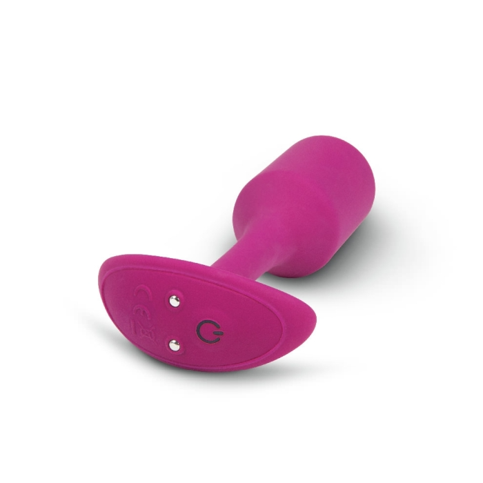 A rose-colored silicone vibrating snug plug with a flared base and power button.