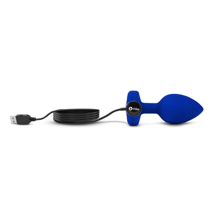 A navy blue silicone vibrating anal plug with a USB charging cable.