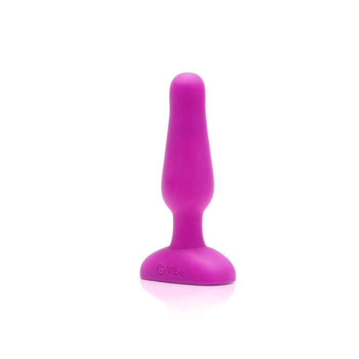 A fuchsia vibrating anal plug with a flared base.