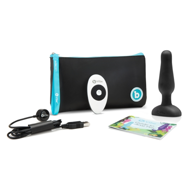 Black silicone vibrating anal plug with remote, charging cable, and travel case.