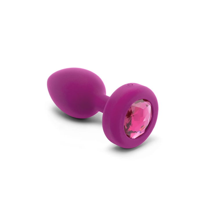 Fuchsia silicone vibrating anal plug with a pink jewel accent.
