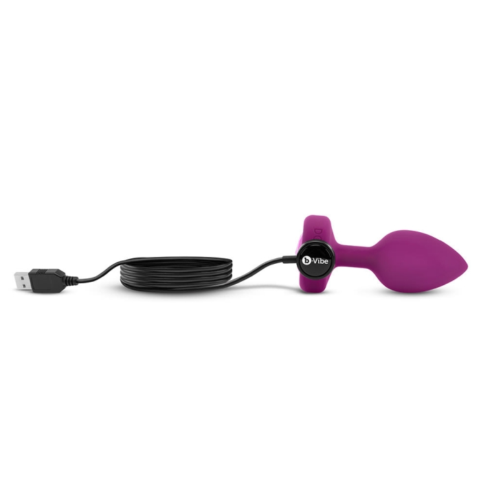 Fuchsia silicone vibrating anal plug with USB charging cable.