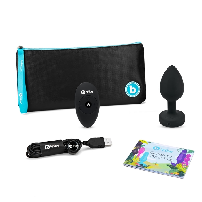 A black vibrating anal plug set with a remote, charging cable, and guide.
