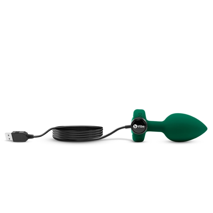 A green silicone vibrating anal plug with a USB charging cable.