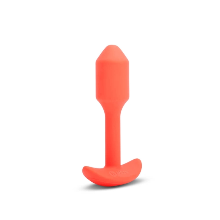 Orange silicone vibrating plug with a weighted base.