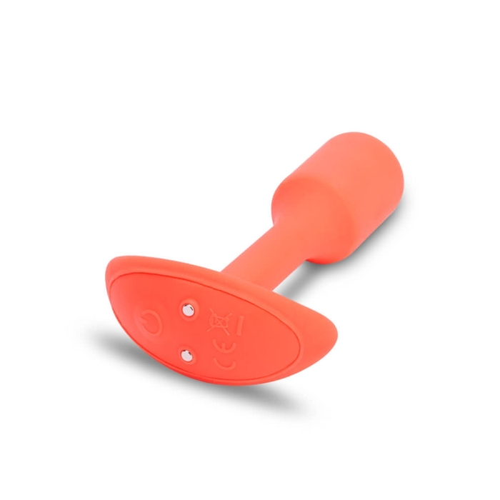 Orange silicone vibrating anal plug with a flared base.
