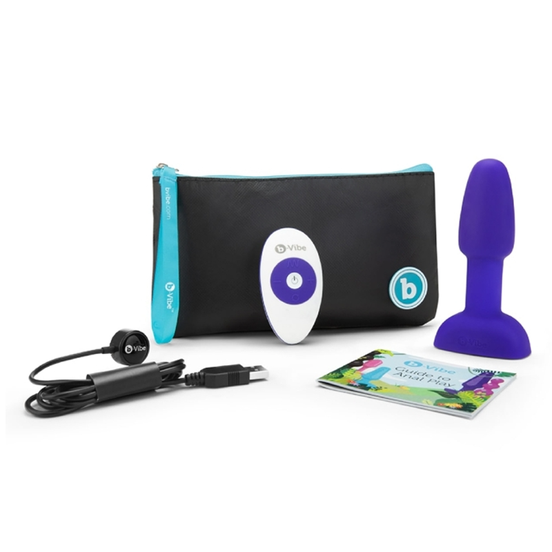 Purple vibrating anal plug with remote, charging cable, and travel case.