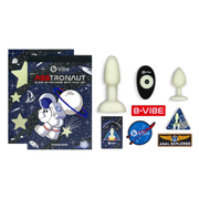 Glow-in-the-dark anal training set with silicone plugs and space-themed accessories.