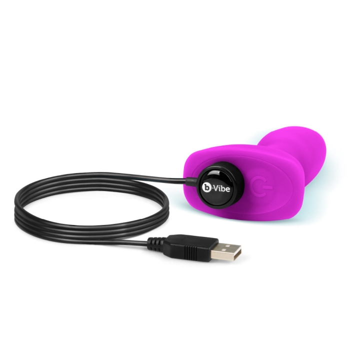 Fuchsia b-Vibe rimming plug with USB charging cable.