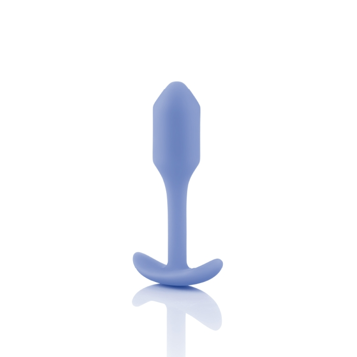 A violet weighted silicone anal plug with a flared base.