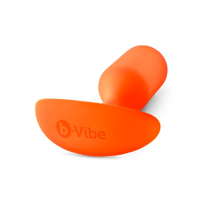 Orange b-Vibe Snug Plug 3 weighted silicone anal plug.