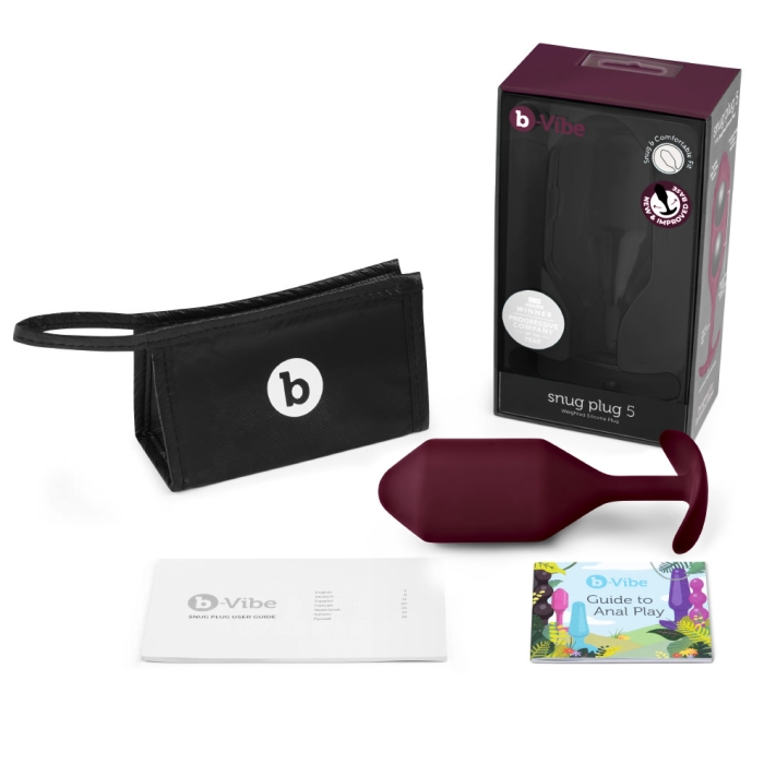Dark red b-Vibe Snug Plug 5 weighted silicone anal plug with storage bag and guide.