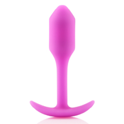 Fuchsia weighted silicone anal plug with a flared base.