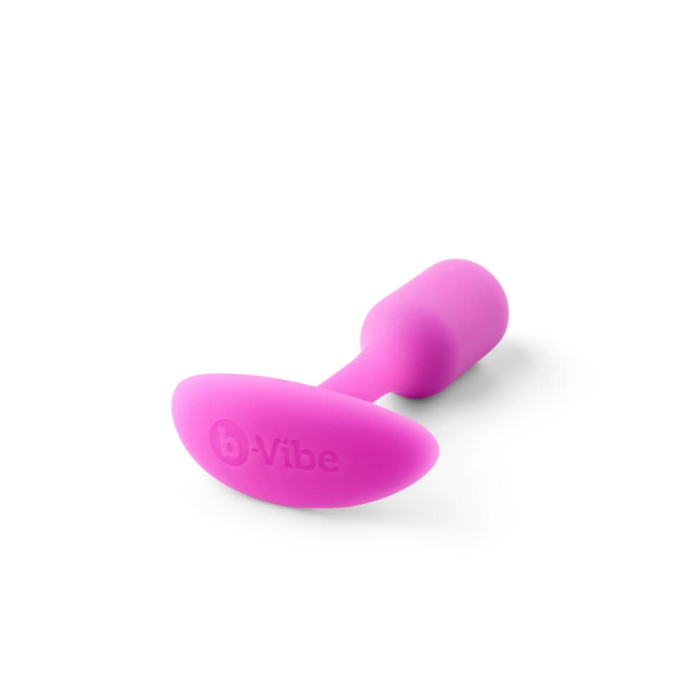 A fuchsia weighted silicone anal plug with the b-Vibe logo.