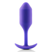 A purple silicone anal plug with a flared base.
